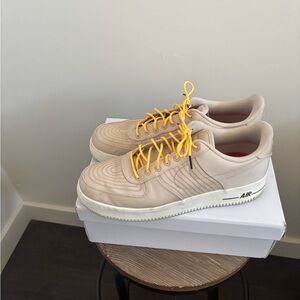 Nike Men’s Beige Athletic Shoes with Yellow Laces